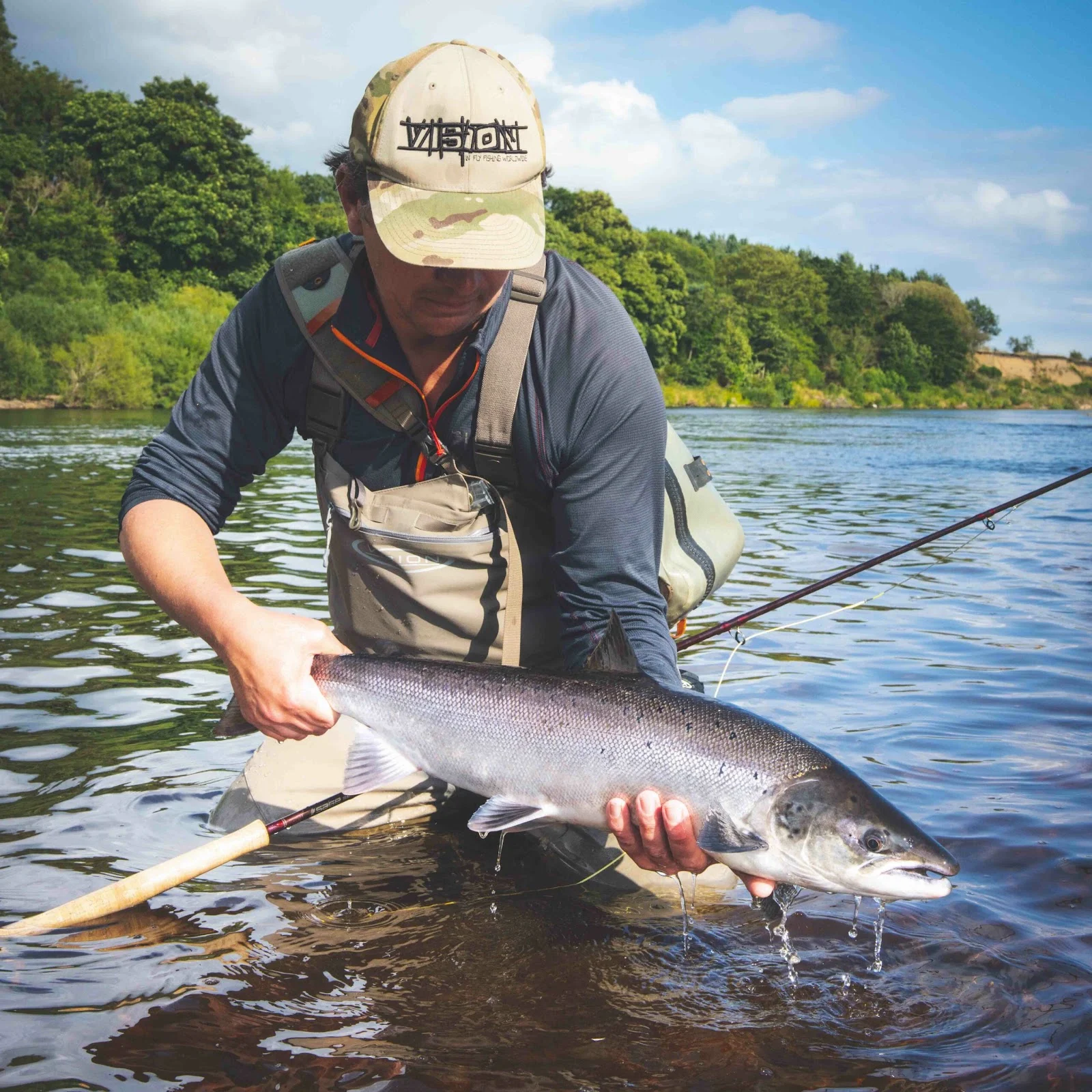 If Jim could catch only one more fish, it would be a fresh Atlantic salmon Jim Fearn holding a fresh Atlantic salmon while fly fishing
